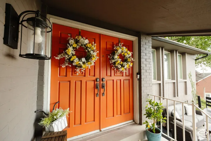 Double entry doors with panel details and black hardware