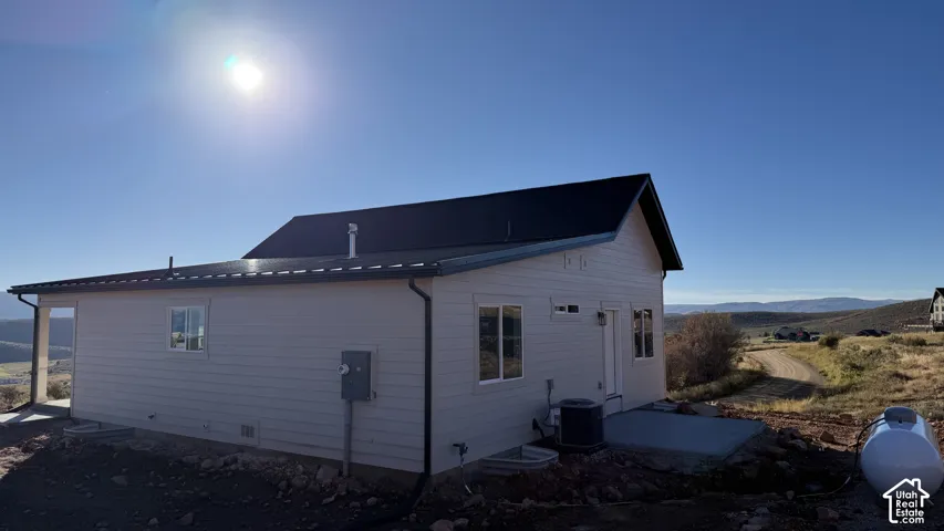 New construction residence featuring horizontal siding and a dark shingle roof