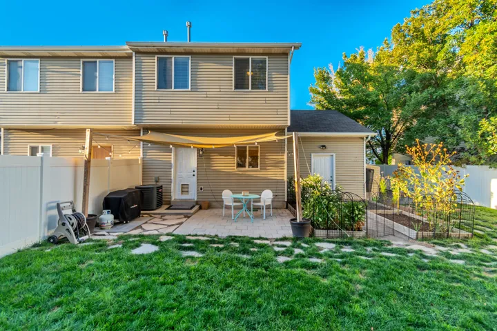Spacious backyard with shaded patio and garden area