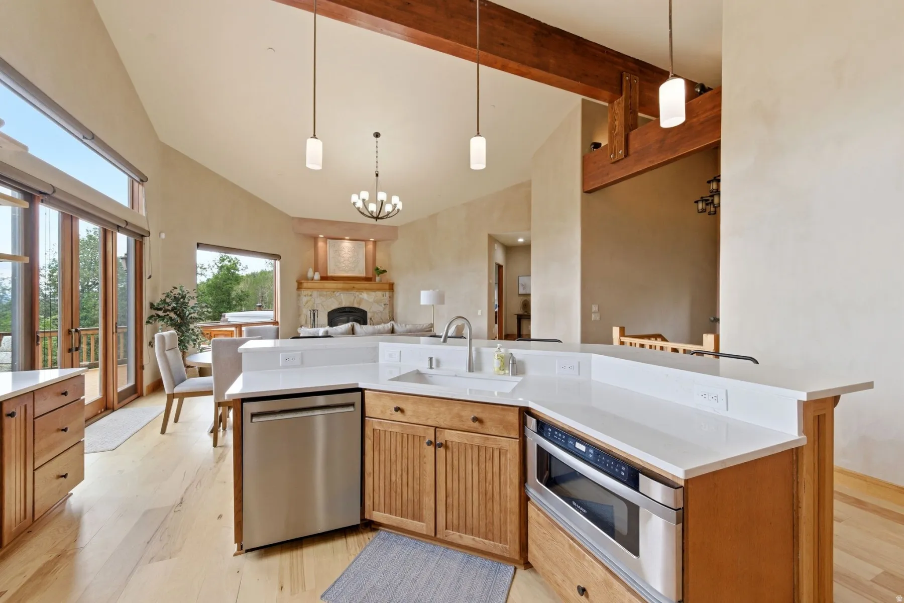 Kitchen featuring wood cabinetry, stainless steel appliances, and white countertops