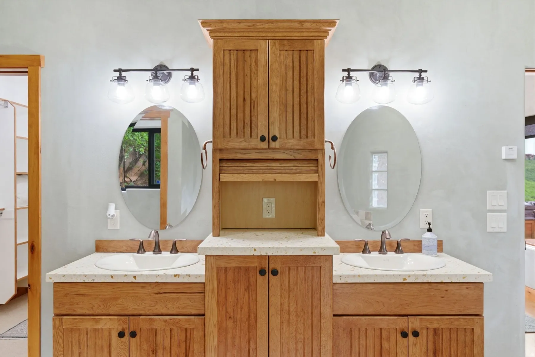 Dual vanity with white undermount sinks and light-toned countertops