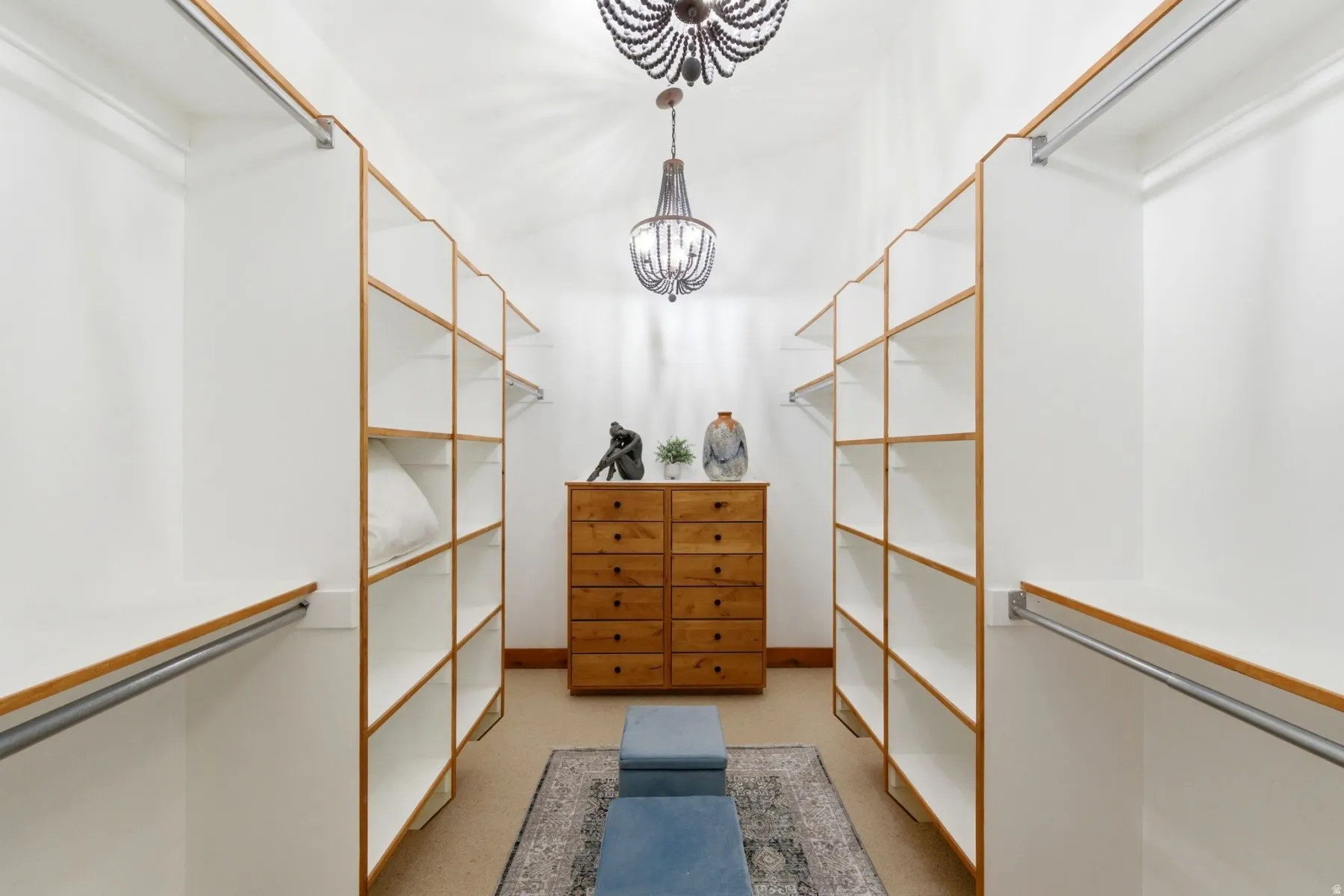 Custom closet system with extensive shelving and hanging rods