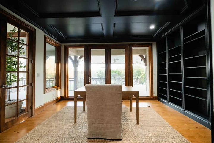 Hardwood flooring paired with a coffered ceiling