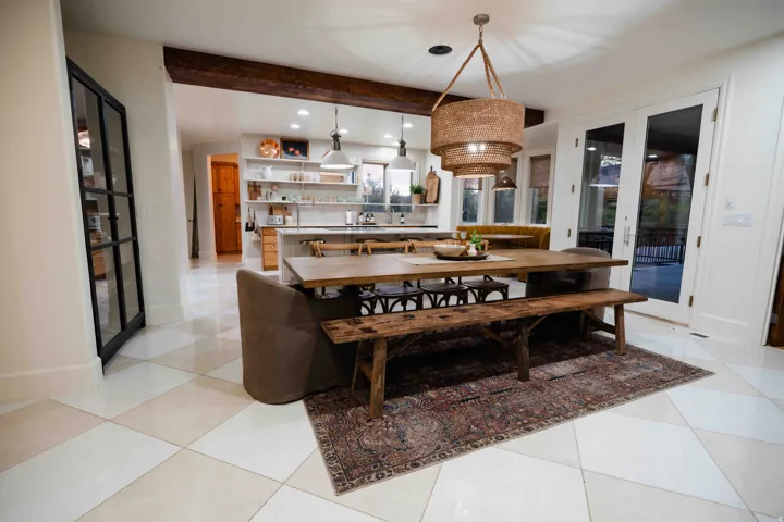 Open concept dining area with checkerboard tile flooring