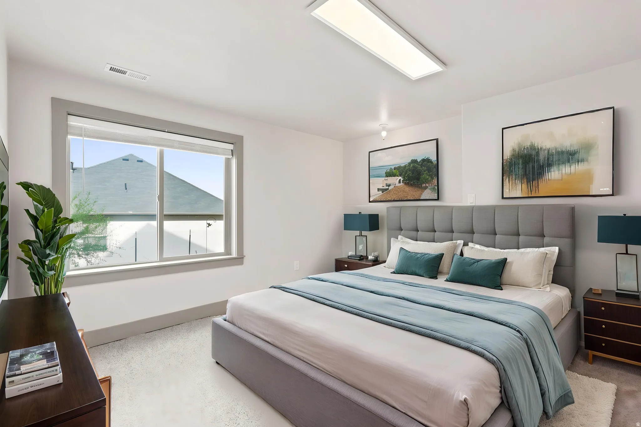 Window with gray trim, plush carpet, recessed ceiling lighting, and a large flush-mount light fixture