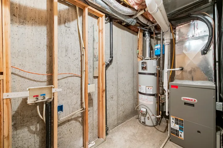 Laundry hookups, water heater, and furnace in utility room.
