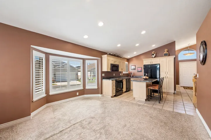 Semi-formal dining area off kitchen w/large window for plenty of light.