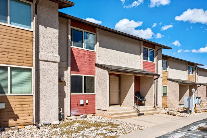 Stucco exterior with wood-finish accents