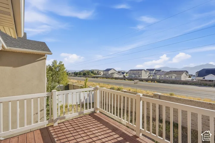Exterior deck with wood-finish flooring and white railing