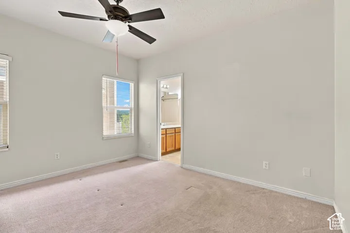 Recessed lighting, ceiling fan, and carpeted flooring