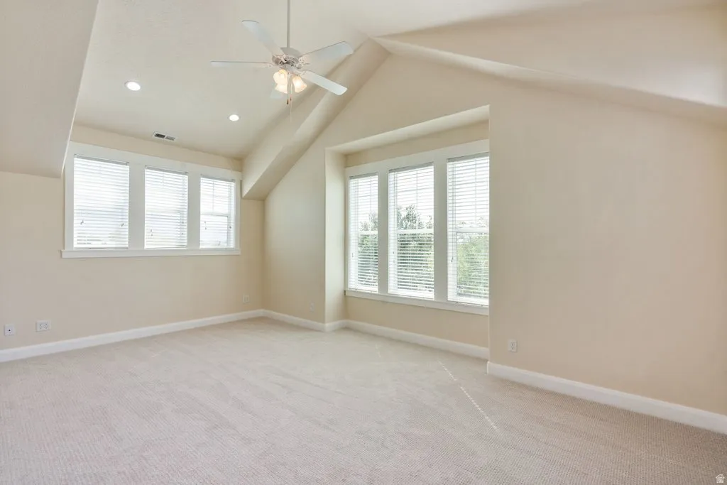 Primary Suite with vaulted ceilings and beautiful windows and light.