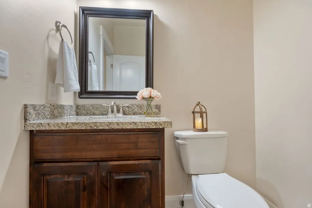 Dark wood-finish vanity with a light-colored countertop