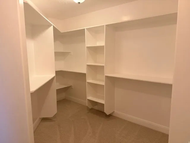 Integrated shelving system with multiple storage levels and soft carpet flooring