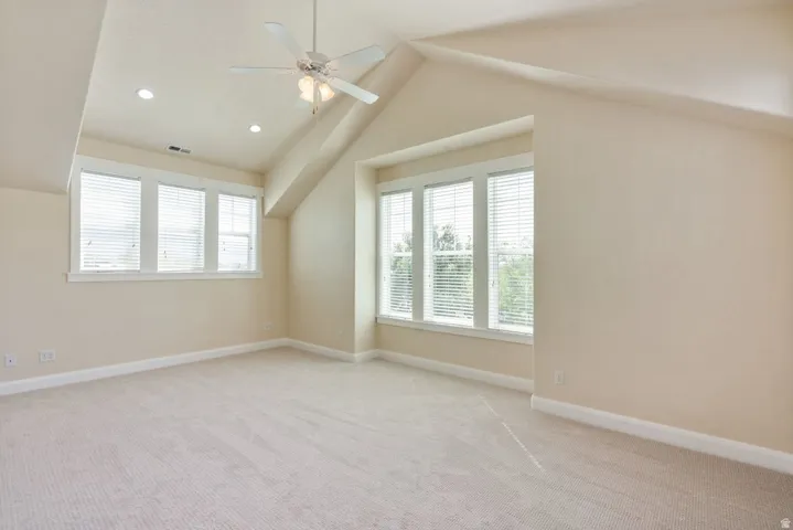 Primary Suite with vaulted ceilings and beautiful windows and light.