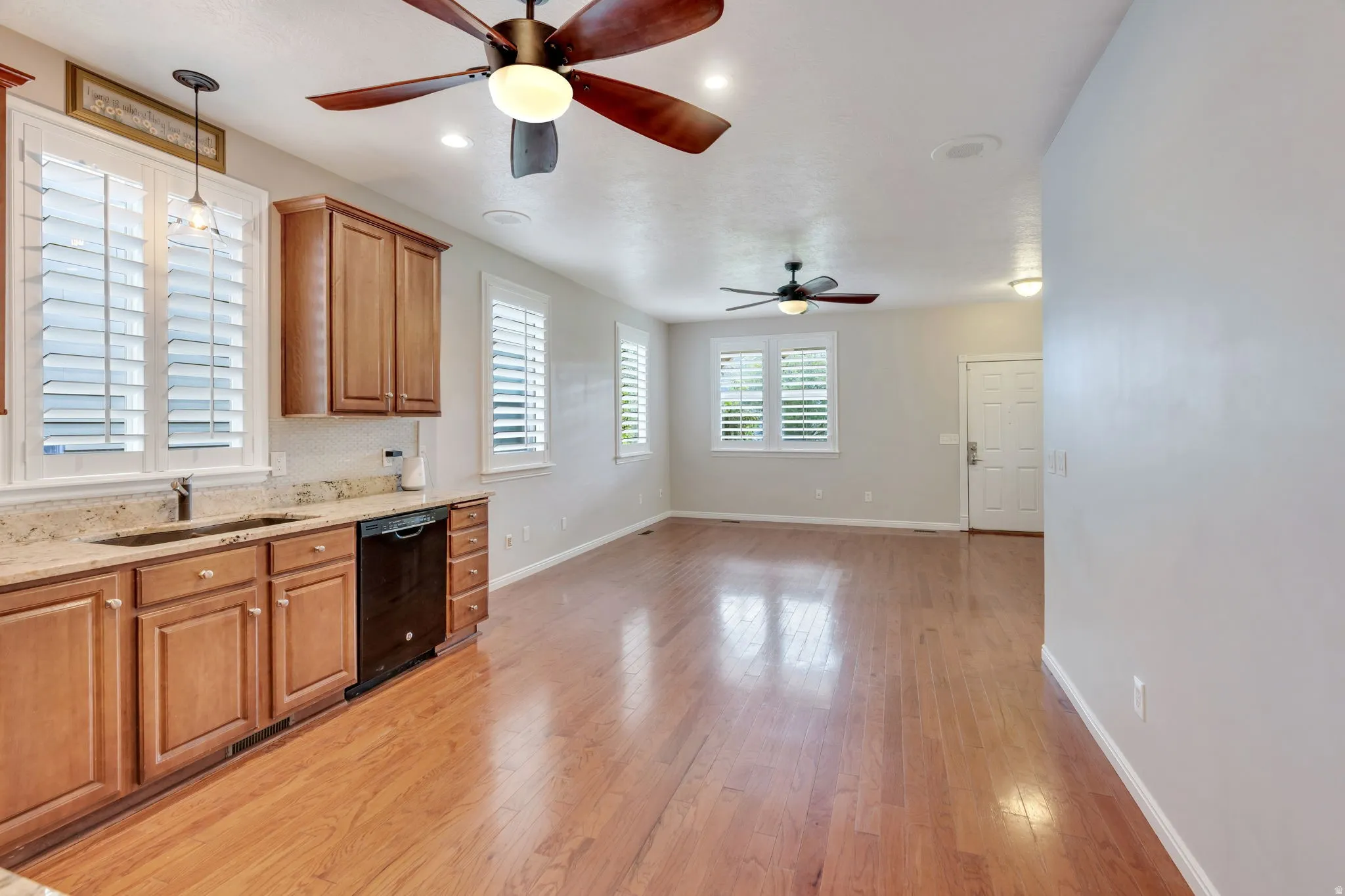 Wood-finish flooring, recessed lighting, and ceiling fans