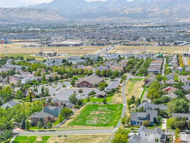 Residential community with established landscaping and mountain backdrop