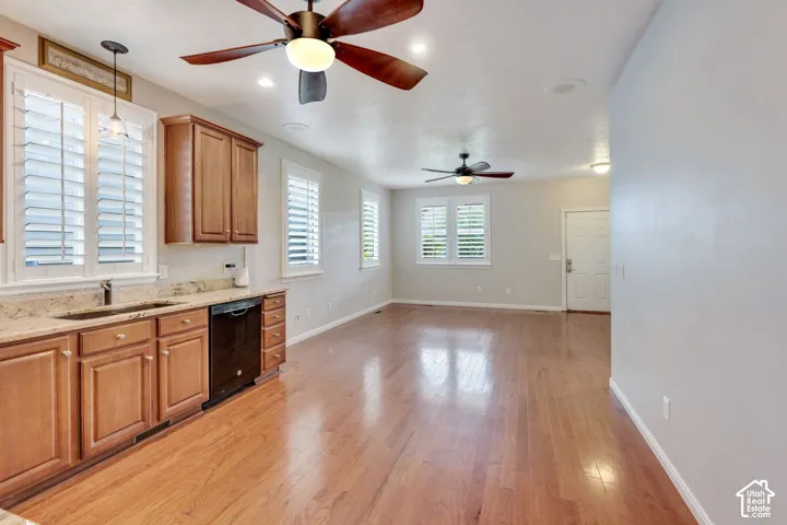 Wood-finish flooring, recessed lighting, and ceiling fans