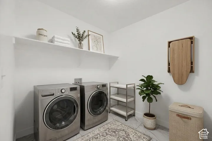 Wall-mounted shelving, built-in appliances, and a wall-mounted ironing board