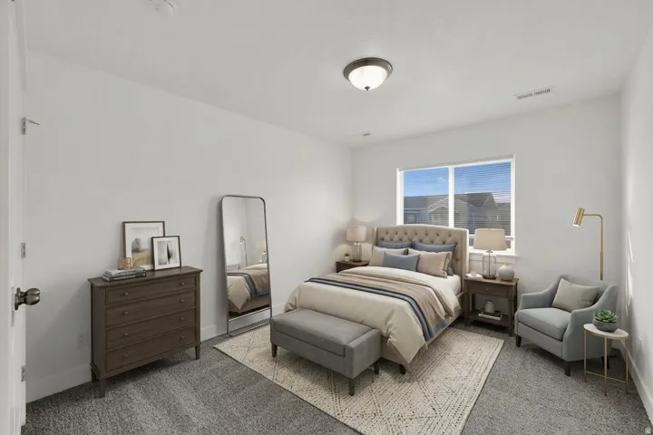 Neutral wall paint, carpeted flooring, window with blinds, and a ceiling-mounted light fixture