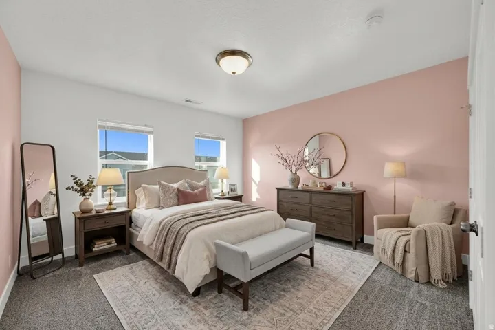 Wall-to-wall carpeting with a light-colored area rug
