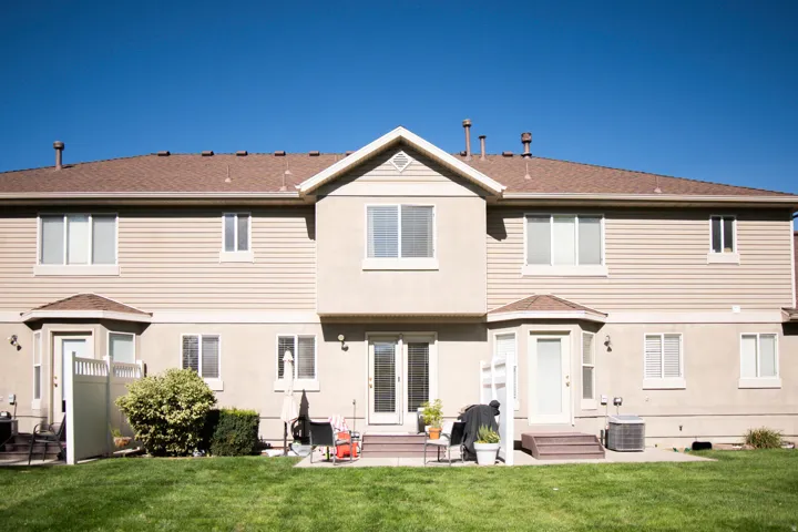 Stucco and siding exterior with multiple windows