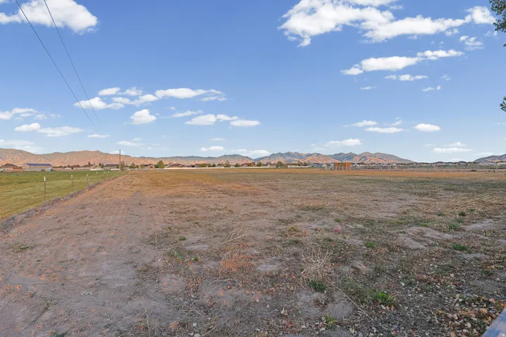 Expansive open lot with distant mountain ranges