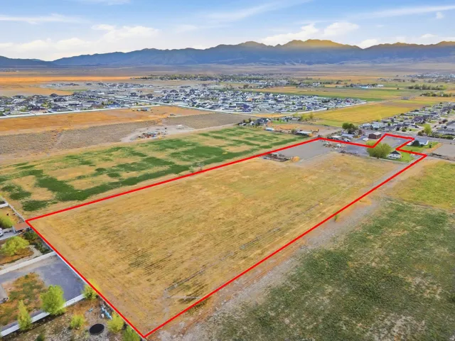 Expansive land parcel with surrounding residential developments
