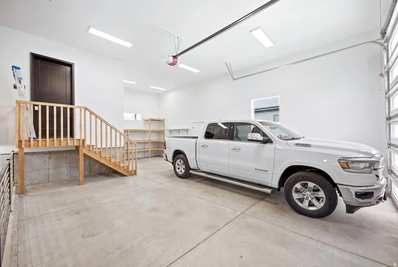 4 car tandum garage with a costco door to unload groceries stright into your pantry. Featuring extra high ceilings, extra length and, extra width