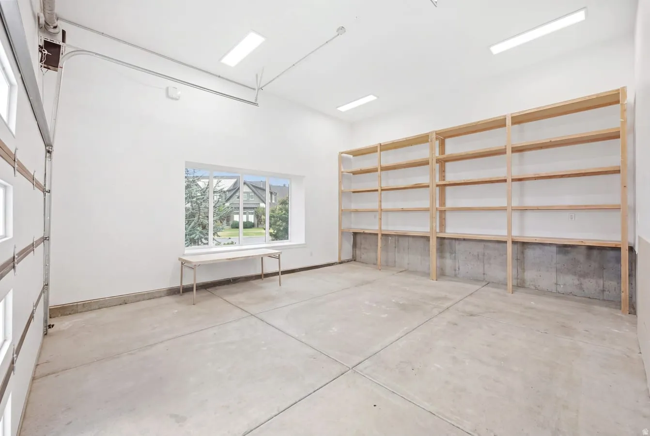 4 car tandum garage with a costco door to unload groceries stright into your pantry. Featuring extra high ceilings, extra length and, extra width