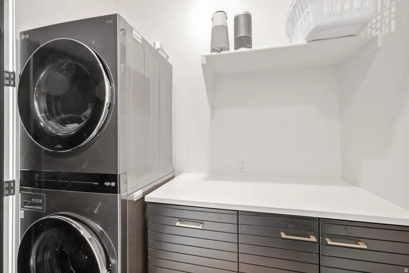 Primary Suite Walk-in closet with stackable laundry