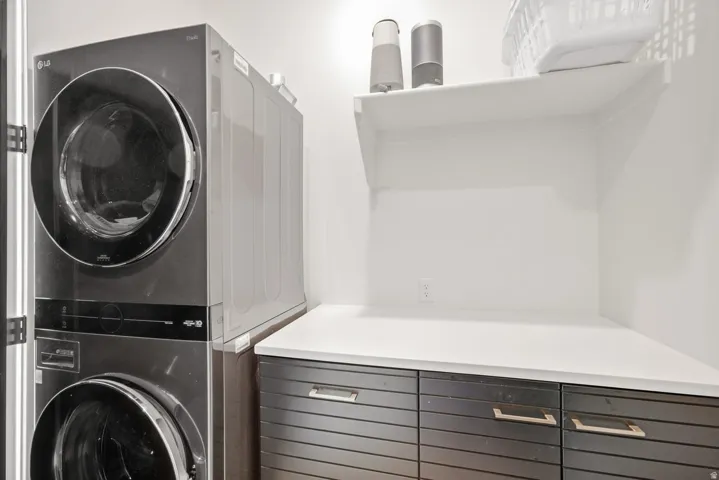Primary Suite Walk-in closet with stackable laundry