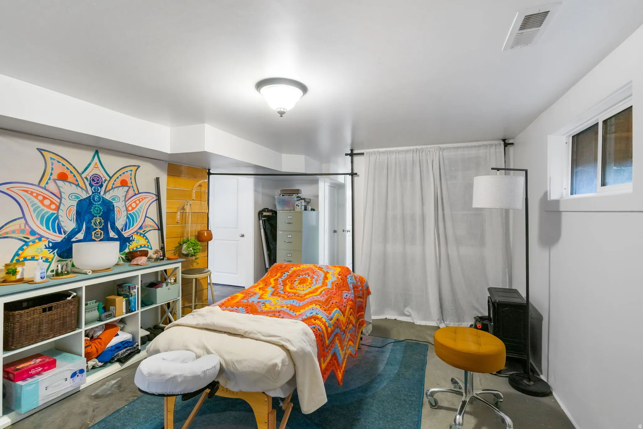 White painted walls and ceiling with a semi-flush mount light fixture