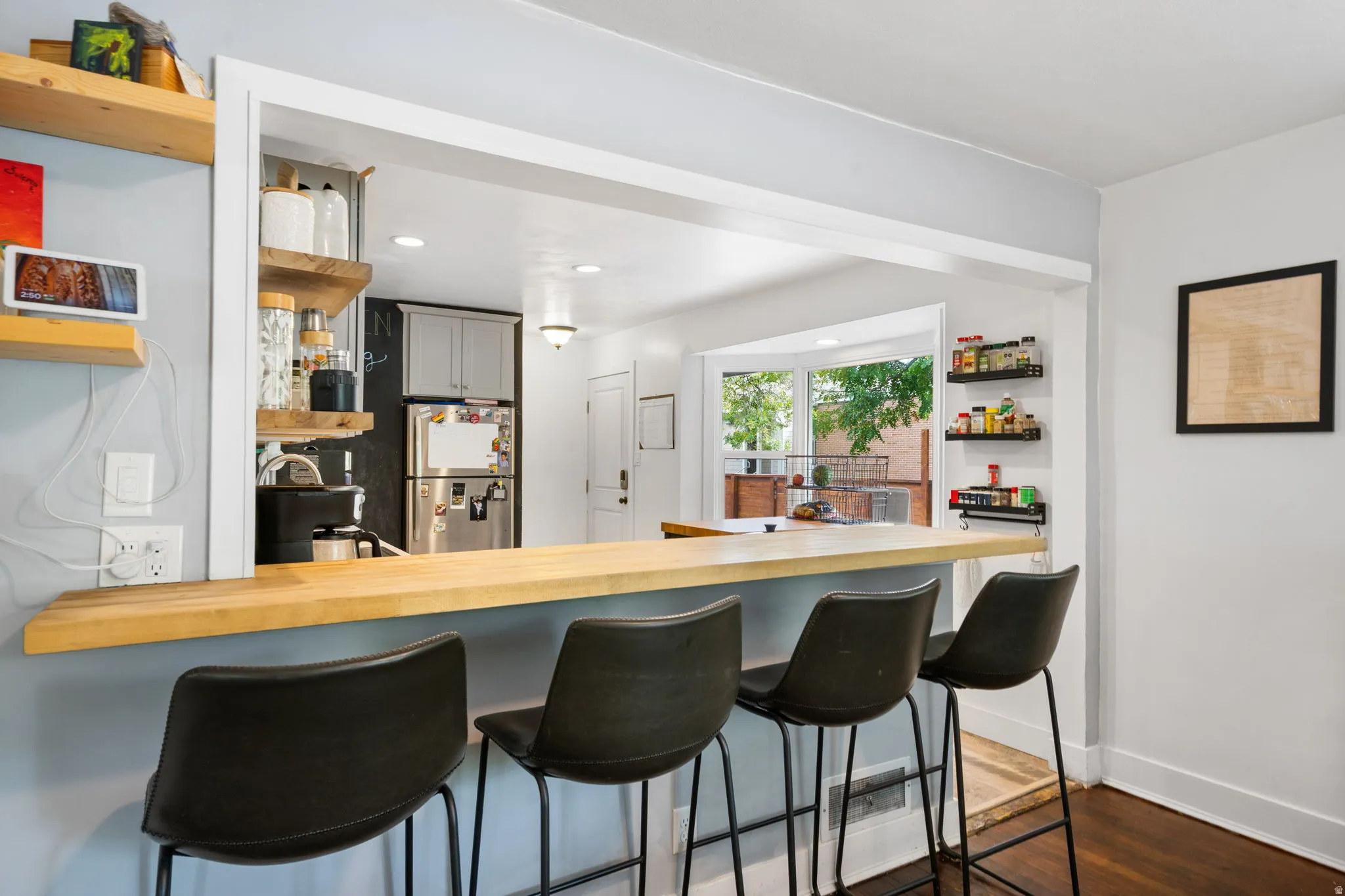 Kitchen pass-through with wood-finish countertop