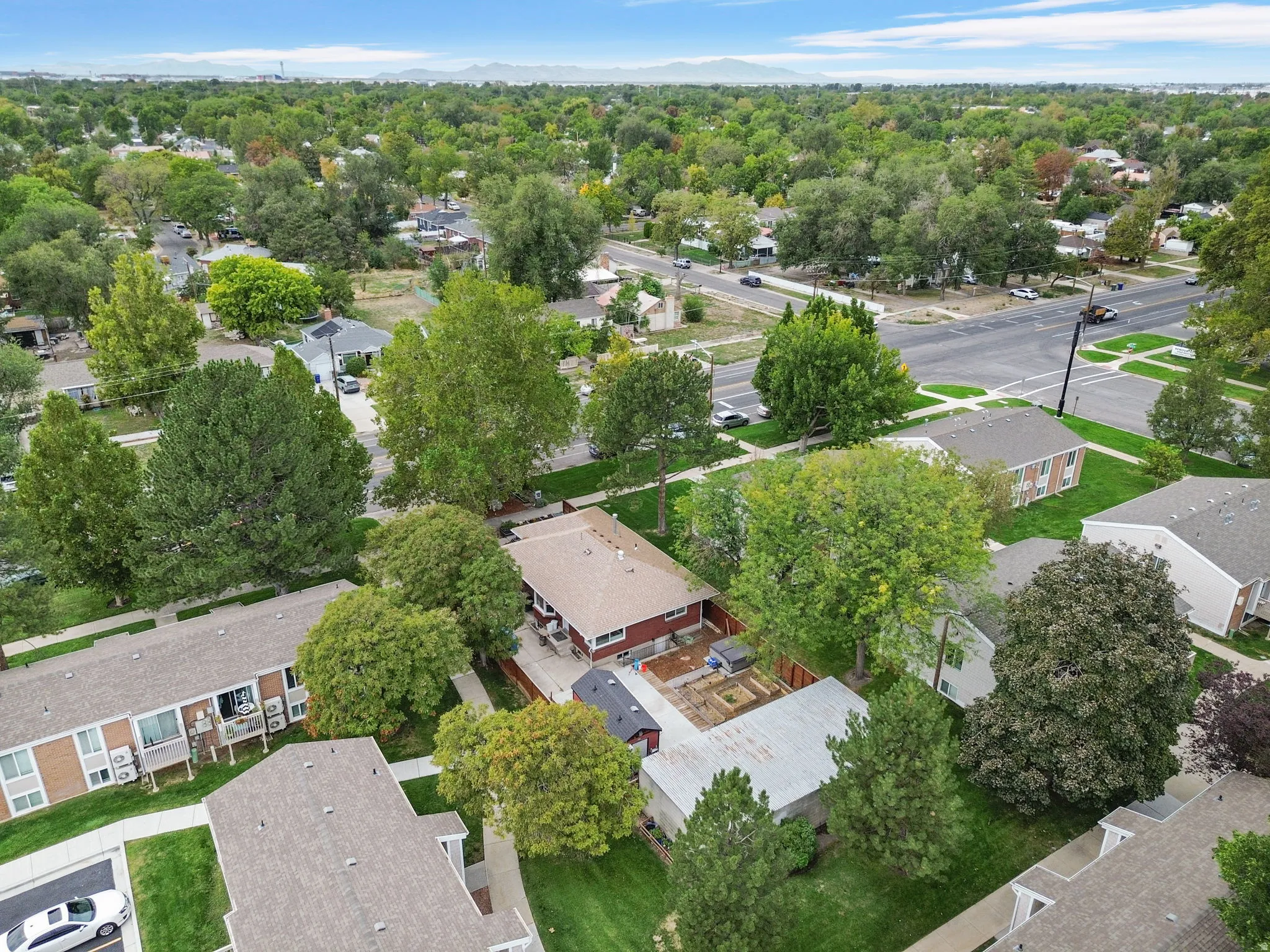 Residential property situated within a tree-lined neighborhood