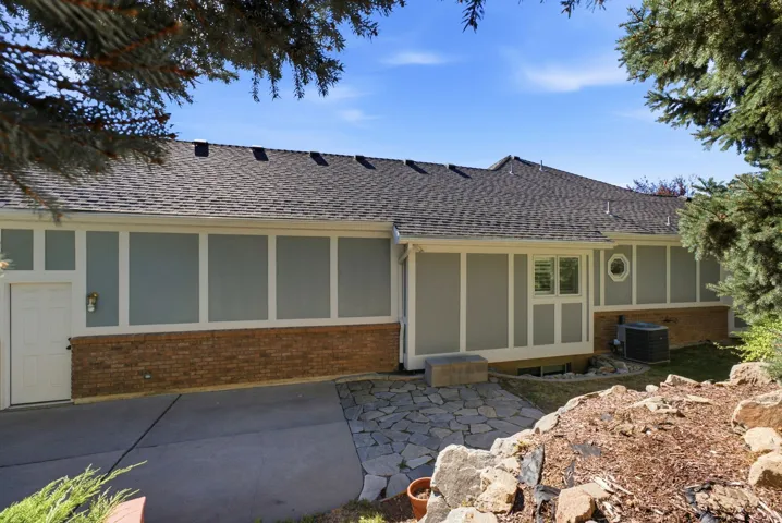 Brick and siding exterior with a shingle roof
