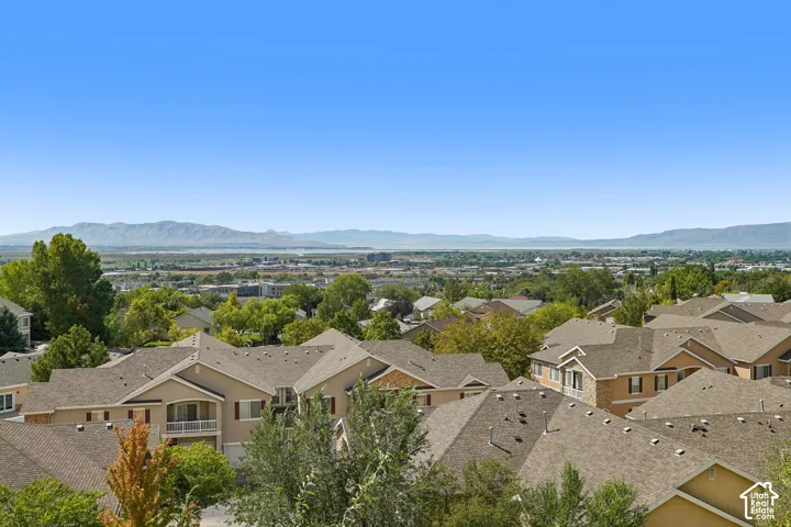 Expansive neighborhood with a distant mountain range and bodies of water