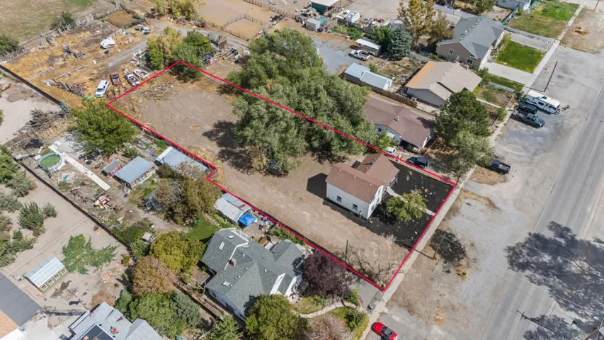 Expansive lot with established trees and a single-story residence