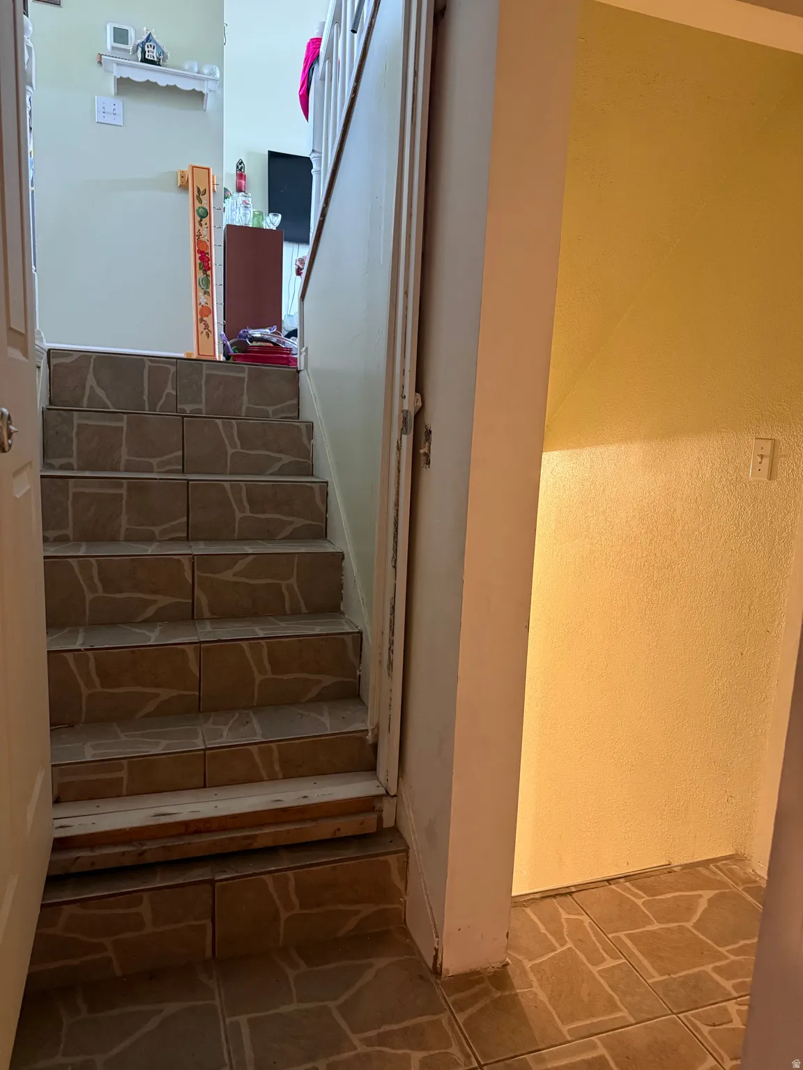 Staircase with tile treads and risers