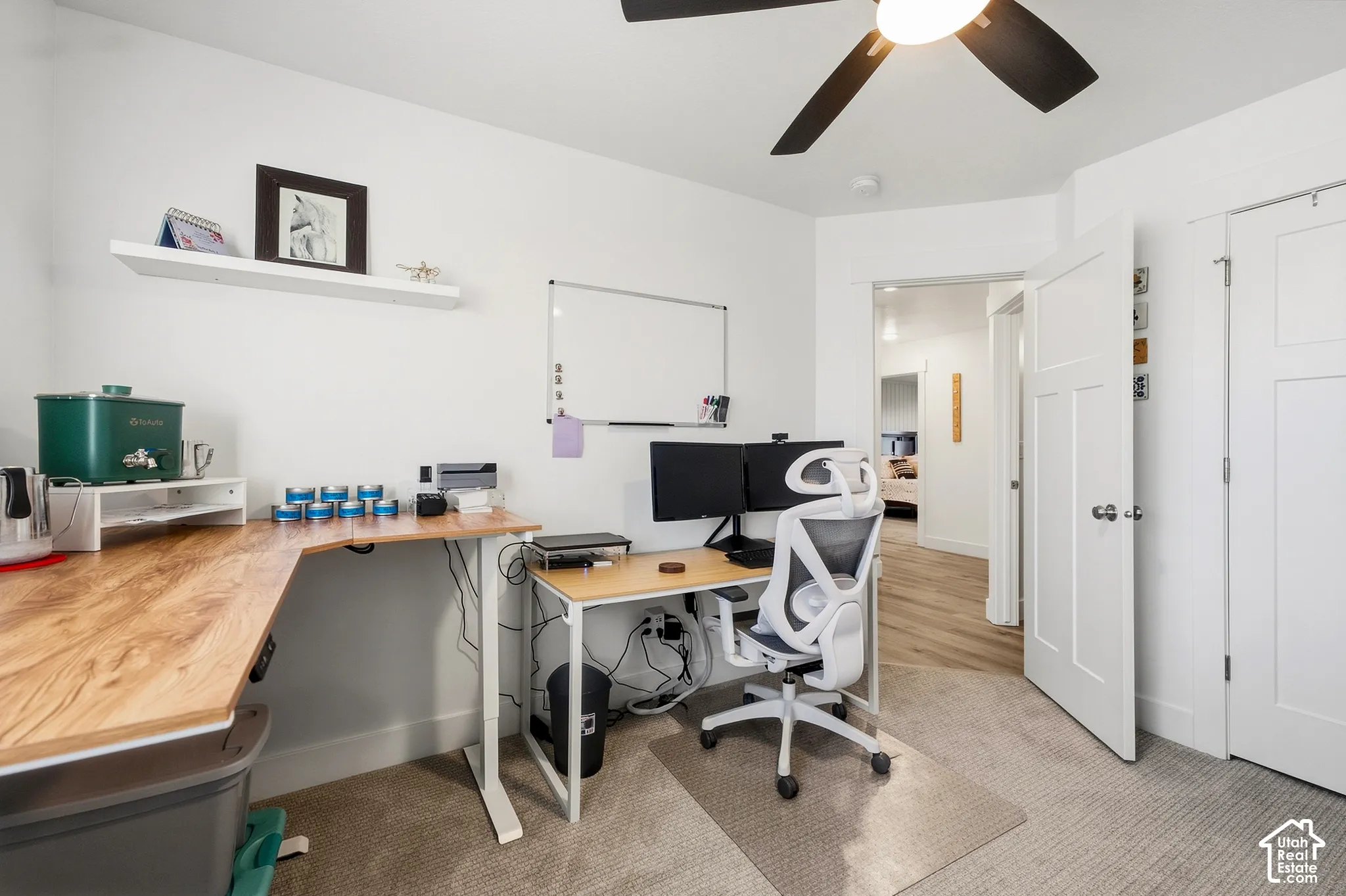 Recessed lighting, wood-finish flooring, ceiling fan with integrated lighting, white interior doors, and clean white walls