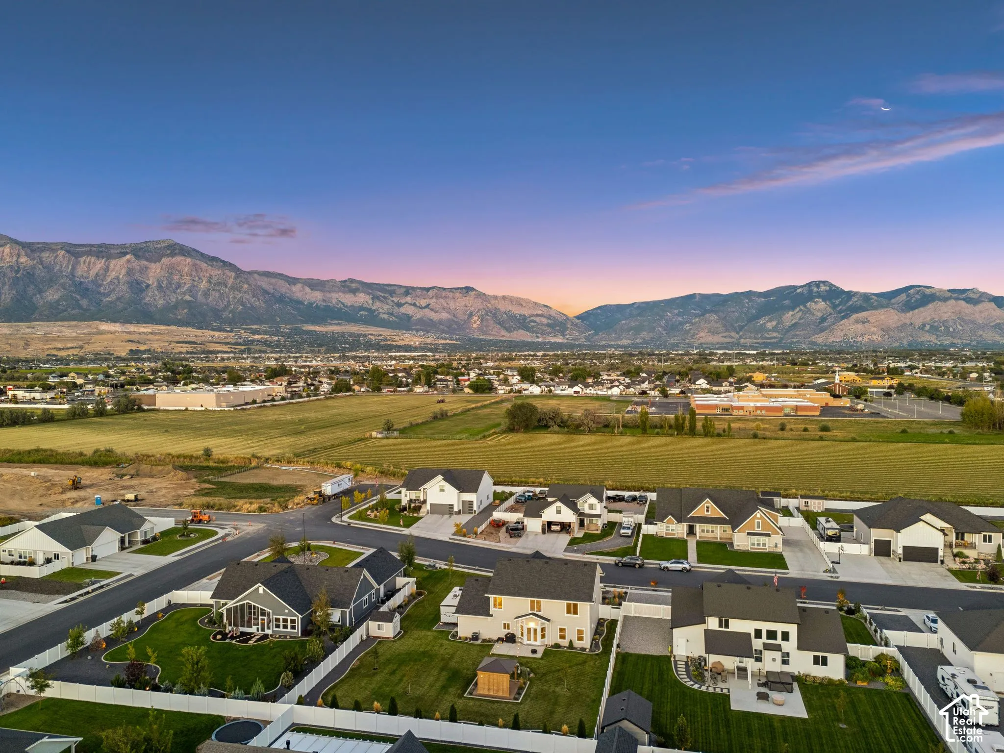 Expansive mountain backdrop with scattered residential developments