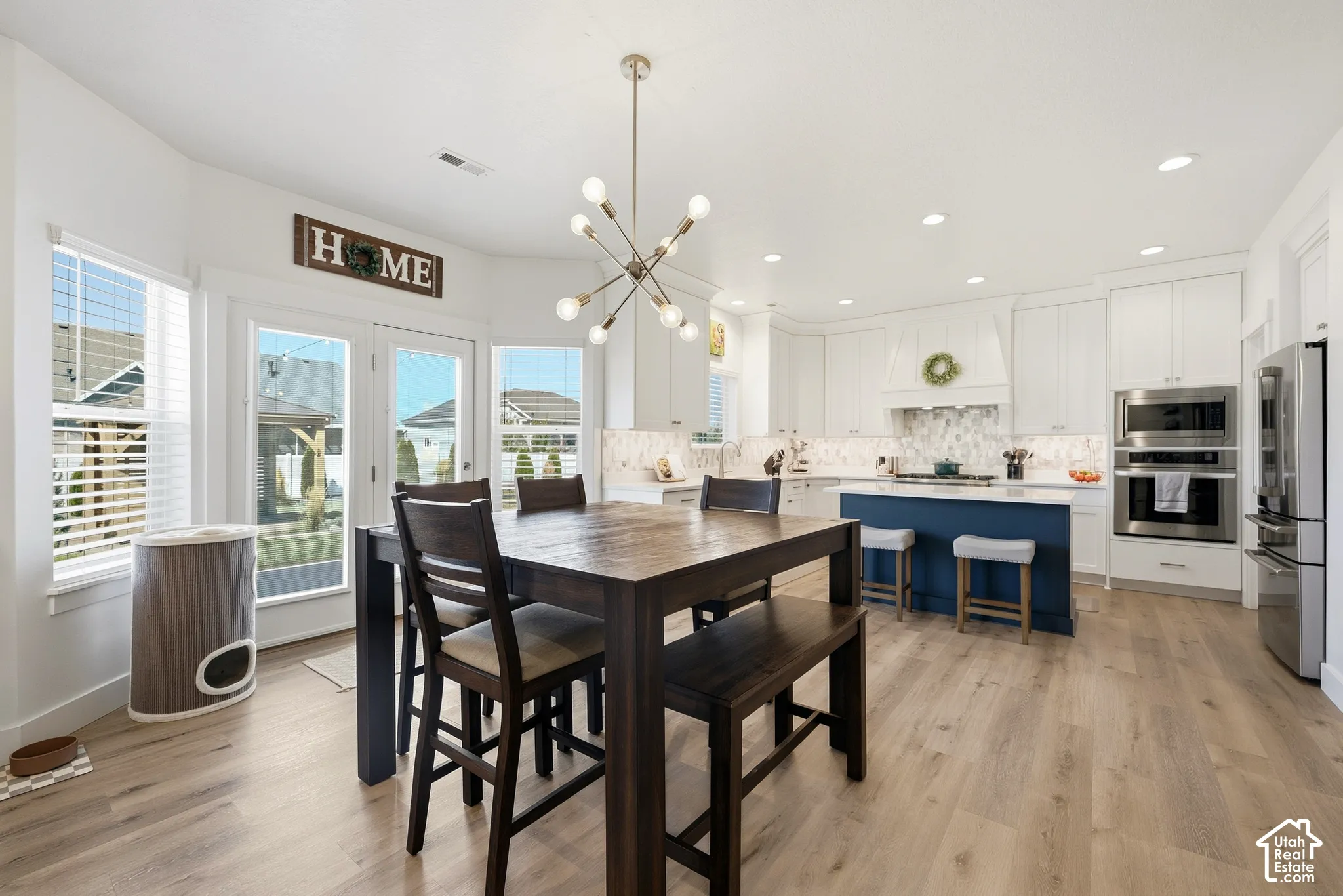 Open-concept kitchen with wood-finish flooring