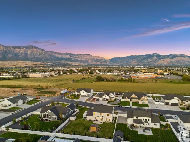 Expansive mountain backdrop with scattered residential developments