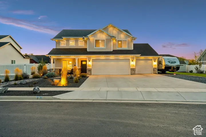 Two-story residence with a two-car garage and an additional single-car garage