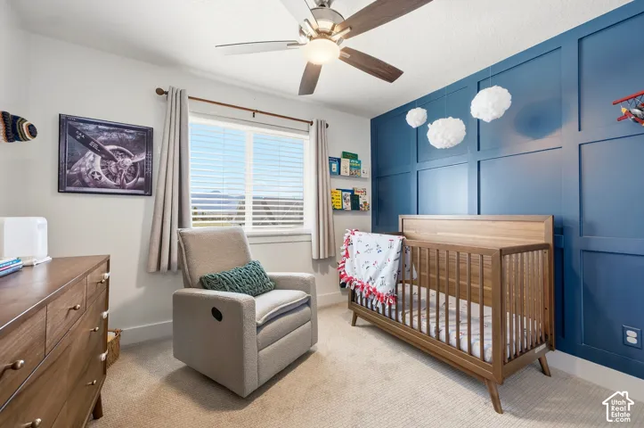 Accent wall with decorative paneling and built-in shelving