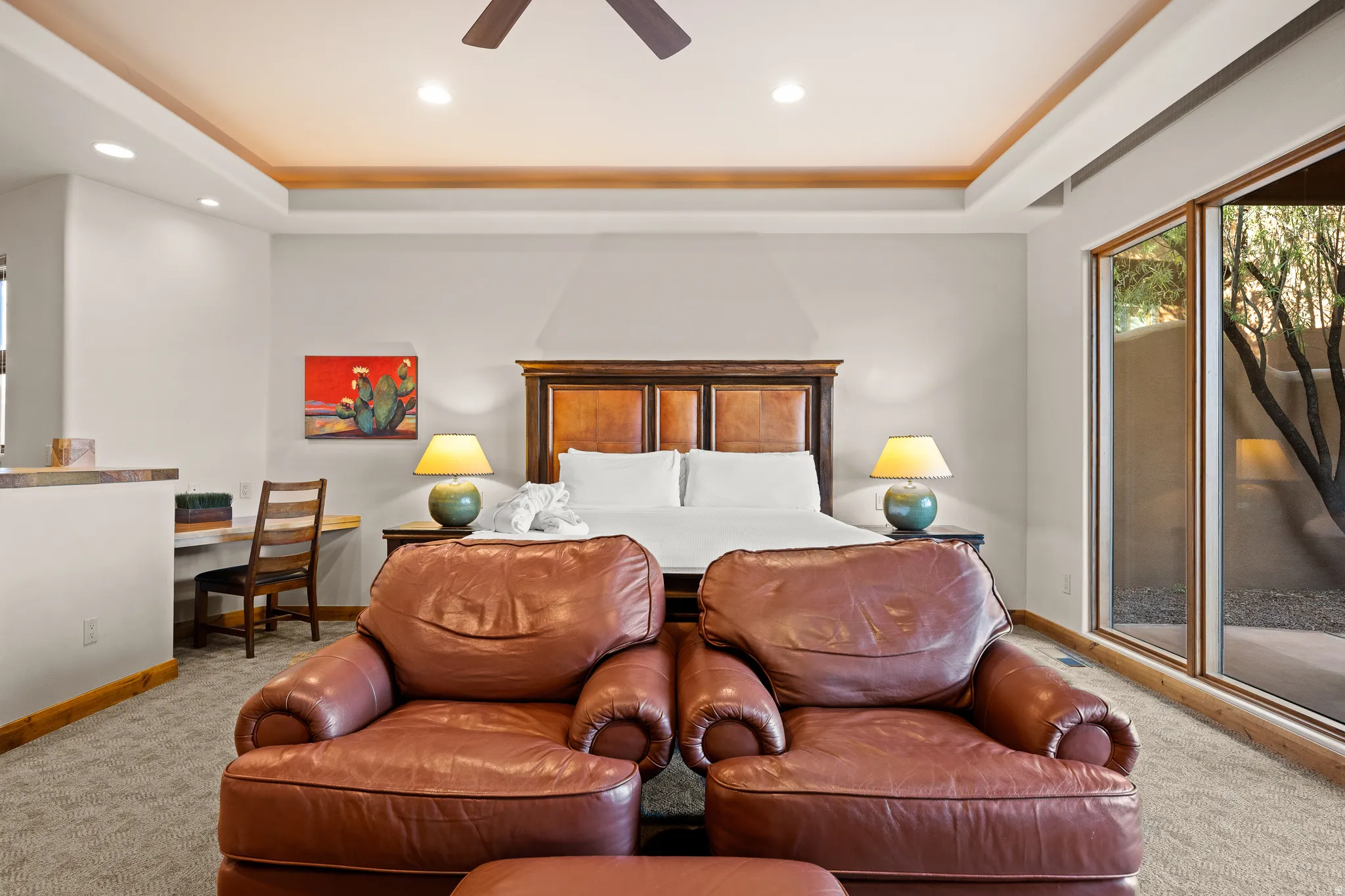 Tray ceiling with recessed lighting and a ceiling fan