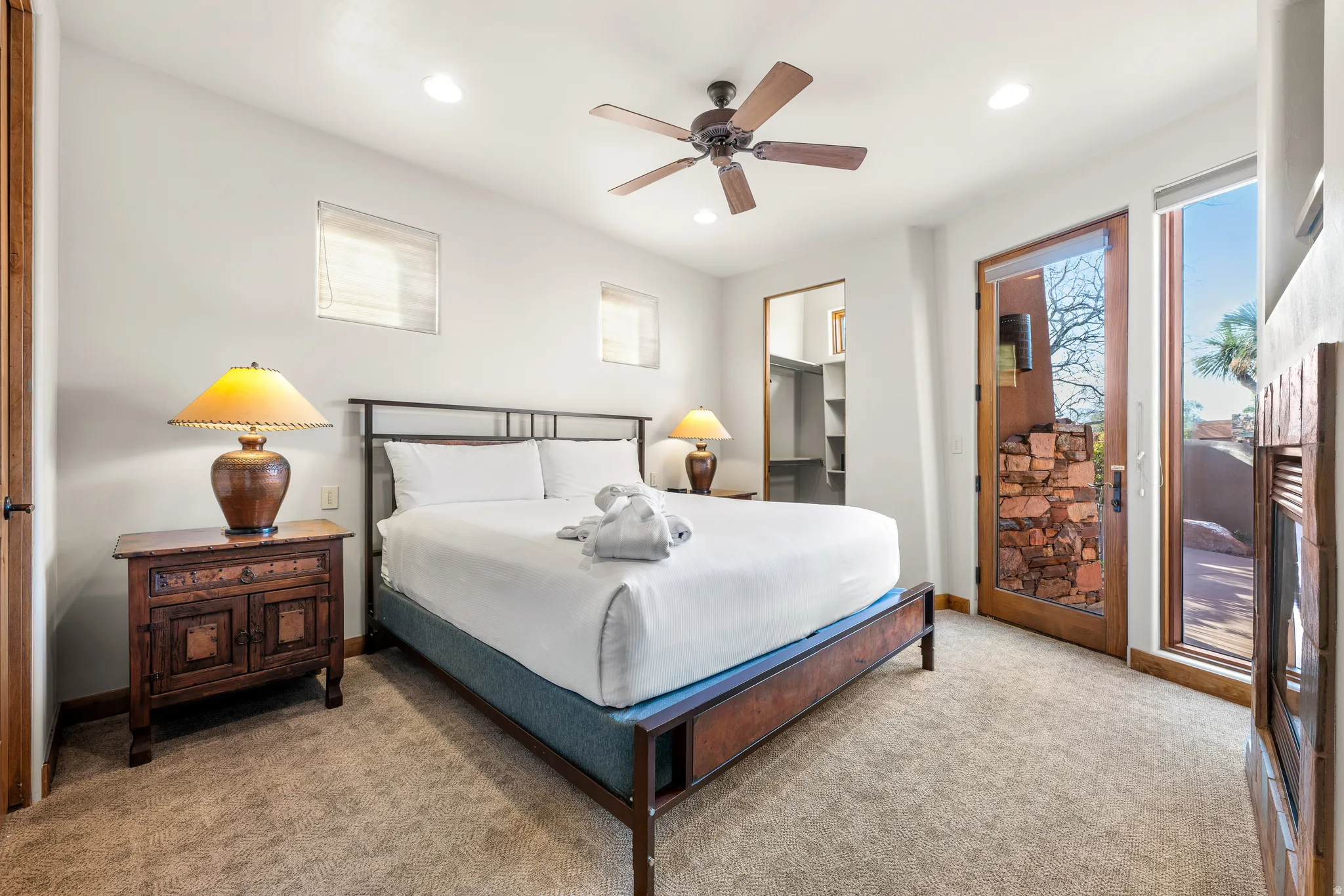 Carpeted room featuring a ceiling fan, recessed lighting, and a built-in closet with shelving