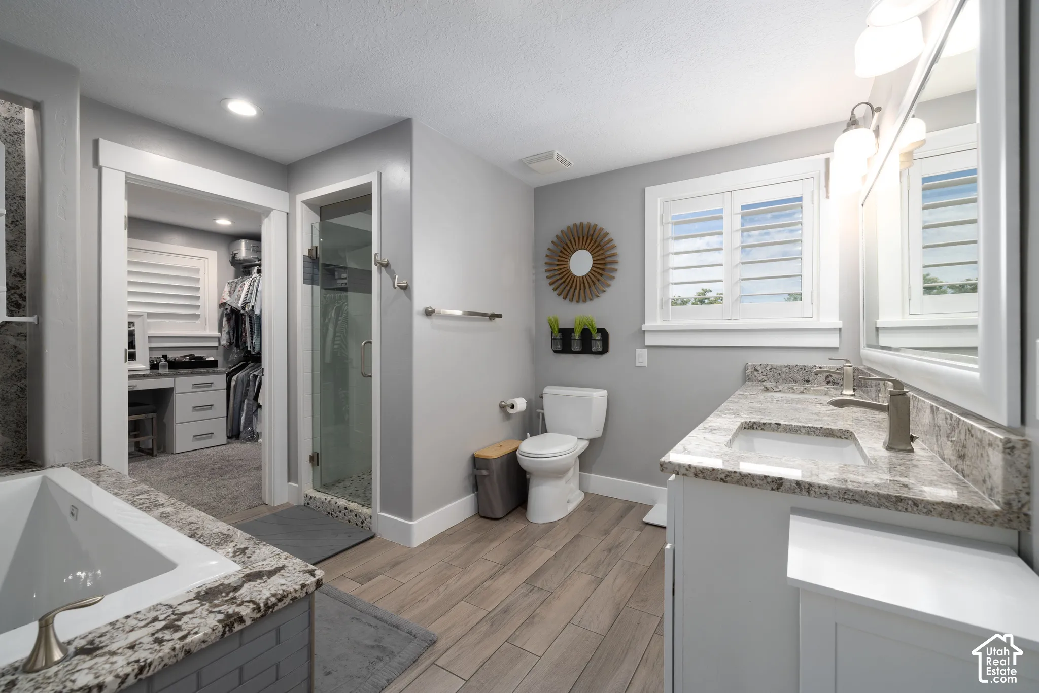 Dual vanity with undermount sinks and light-toned countertops