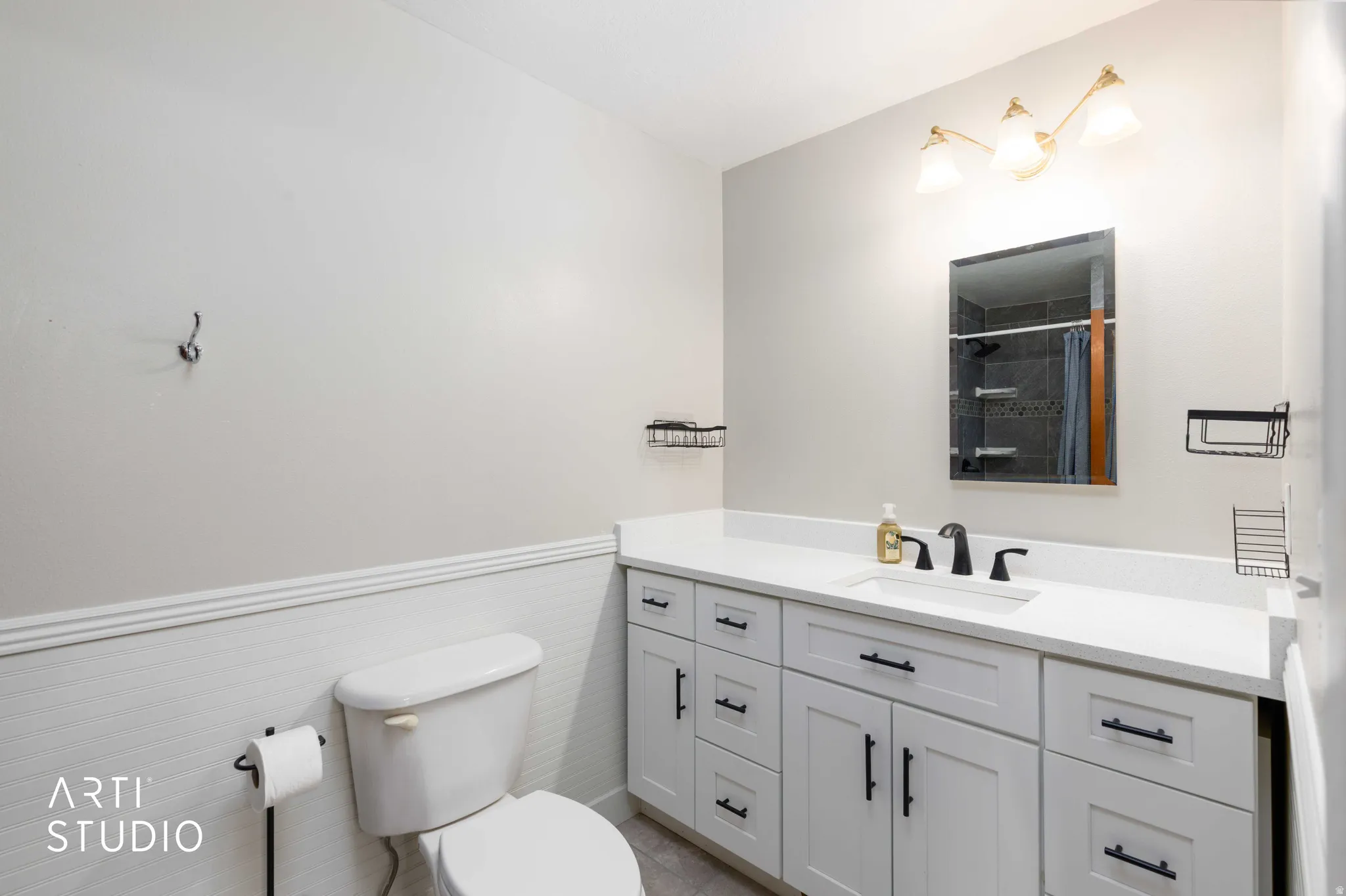 Master Bath showing White shaker-style cabinetry with matte black hardware, a white countertop, and a rectangular undermount sink