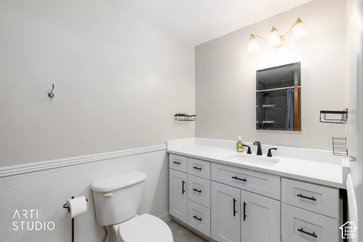 Master Bath showing White shaker-style cabinetry with matte black hardware, a white countertop, and a rectangular undermount sink
