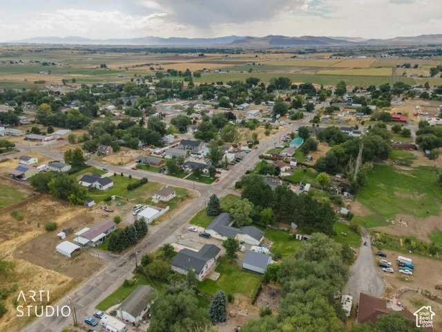 Overhead view of property from the northeast showing Honeyville, Utah in the background.